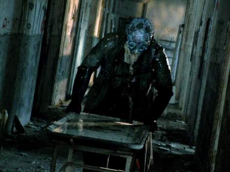 death tunnel guy in a mask gurney stretcher