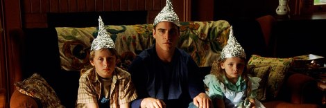 signs movie foil hats joaquin phoenix